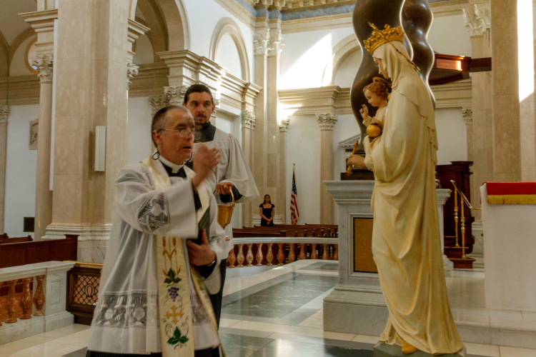 Fr. Marczewski blesses statue of Our Lady