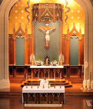 Fr. Markey at the altar of Our Mother of Perpetual Help Chapel