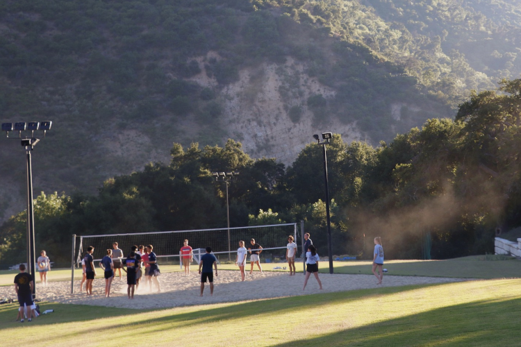 Students play volleyball