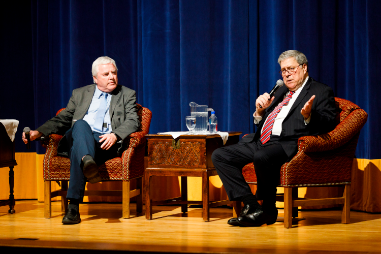 Thomas Aquinas College President Paul J. O’Reilly looks on as Mr. Barr answers students’ questions.