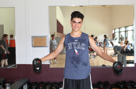 student with dumbbells 