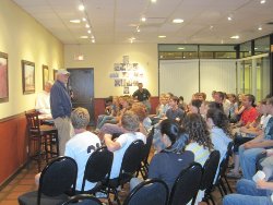 Dr. McLean speaks to the students in the Coffee Shop