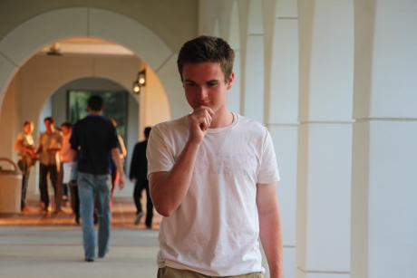 Student walking in the arcade