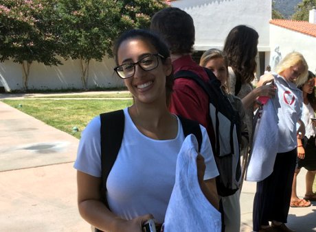 a student receives her t-shirt