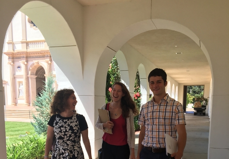 Prefects stroll in the arcade