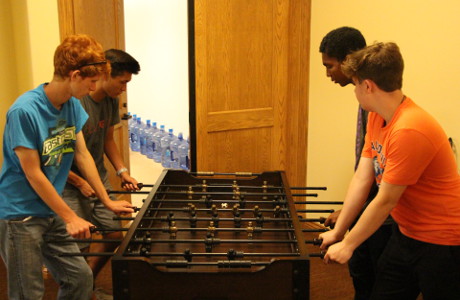 Students play foosball