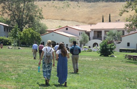 Students walk toward their residence halls