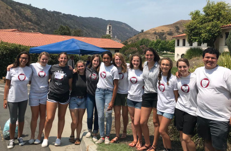 Students pose with Chapel in the background