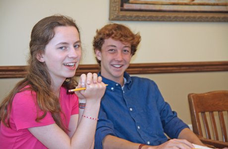 Students sit at the classroom table