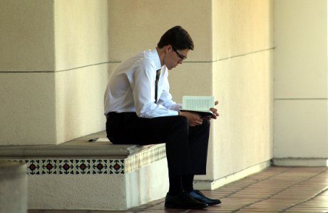 Student studying on a bench