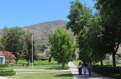 Students walk past St. Joseph Commons