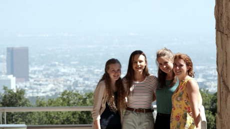 Students pose before the L.A. skyline