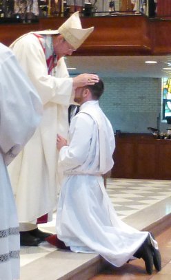 The Most Rev. Gregory Parkes ordains Rev. Matthew Busch (’04