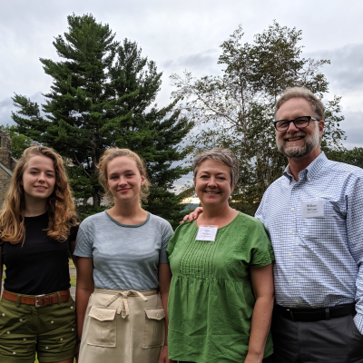 Parents and two daughters on New England campus