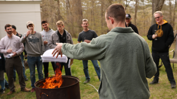 Class of 2024 Prepares for Year’s End with Softball, BBQ, and Thesis Draft-Burning