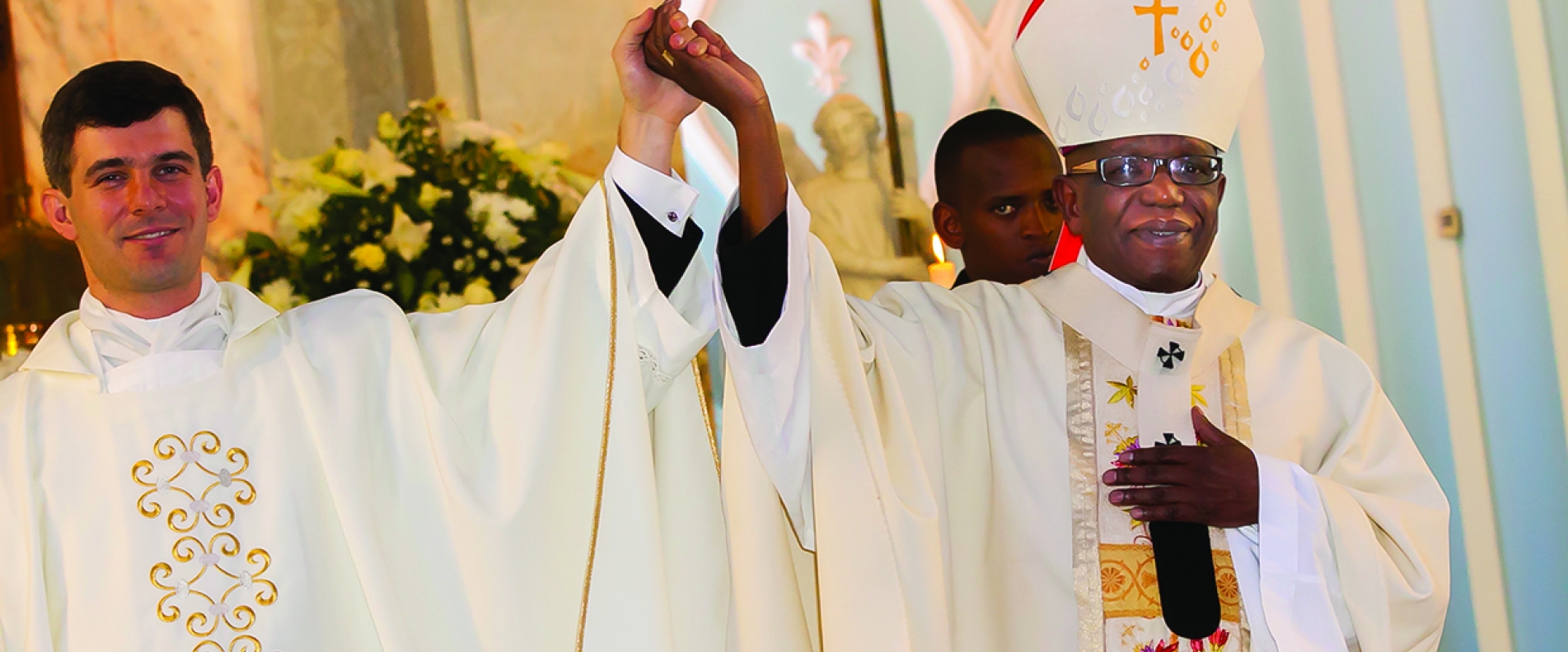 Alumnus priest with his bishop on ordination day