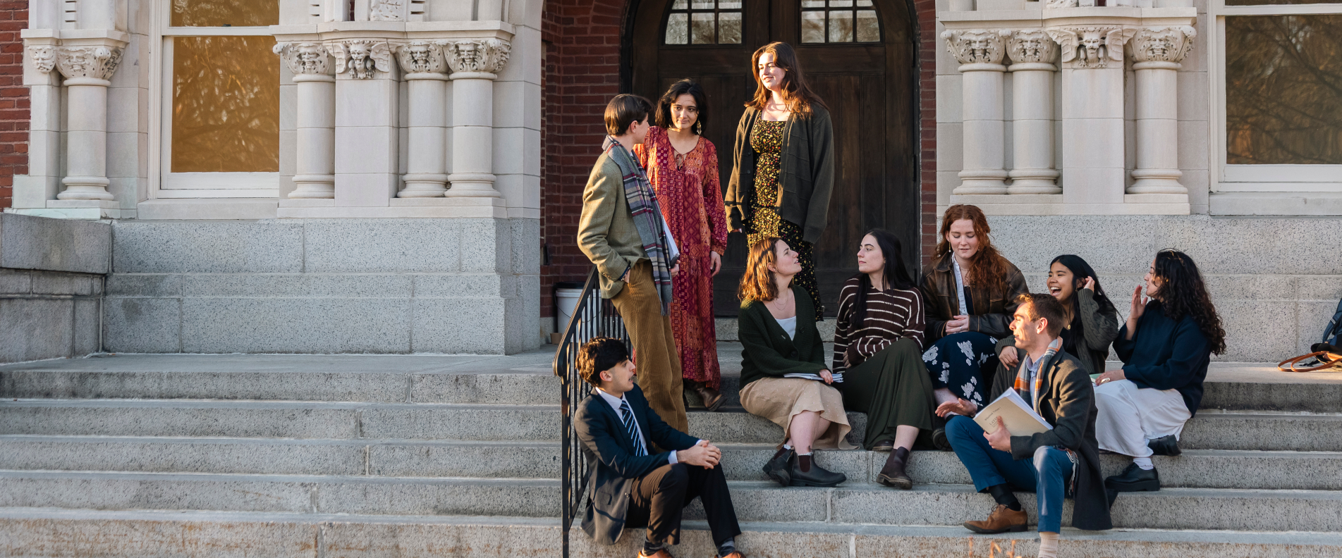 Students wait on steps of St. Gianna Hall