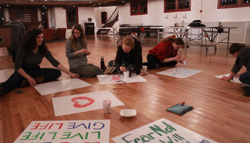 Students make signs for the March for Life