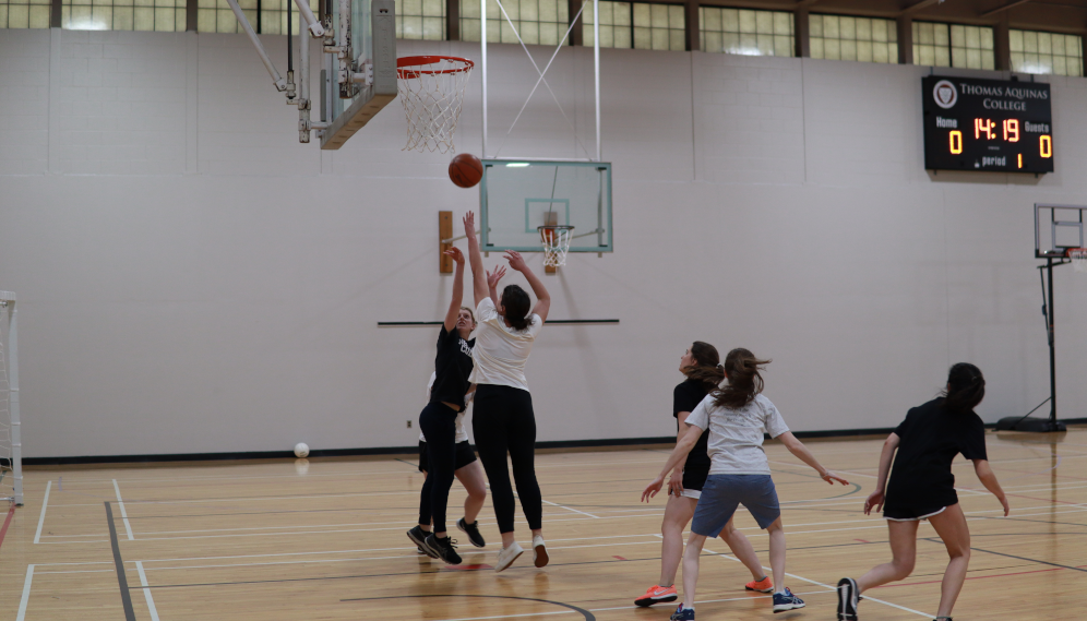 Students play basketball