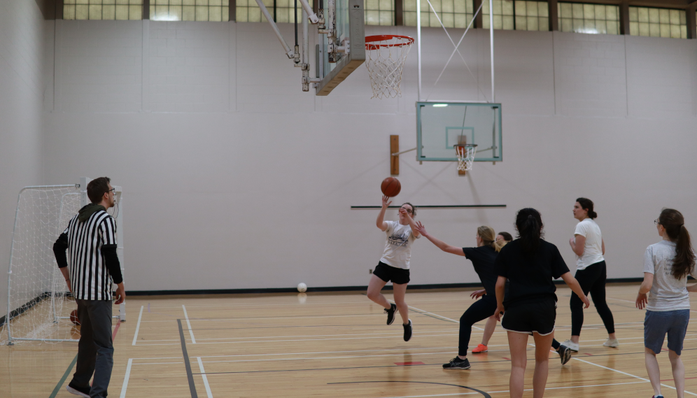 Students play basketball