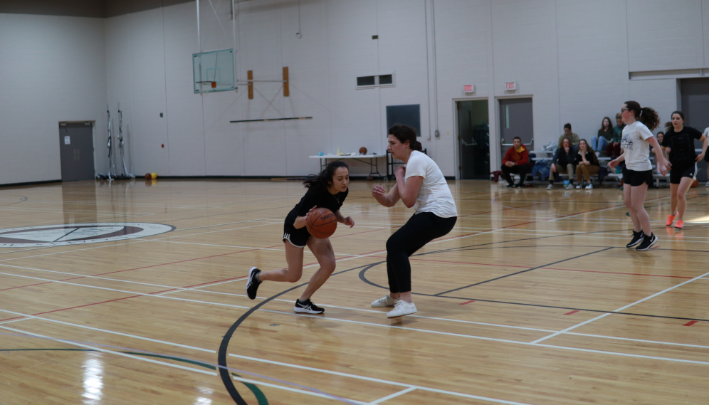 Students play basketball