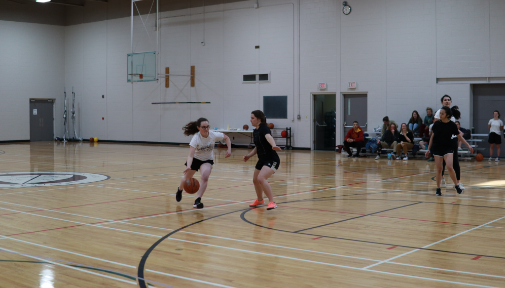 Students play basketball