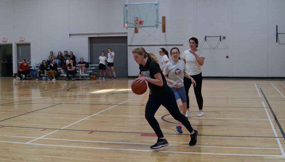 Students play basketball