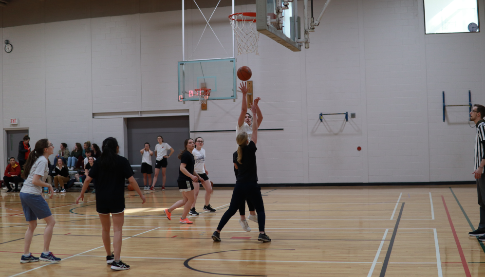 Students play basketball
