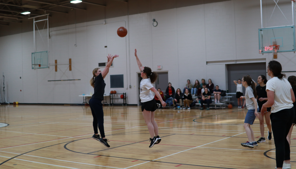 Students playing basketball