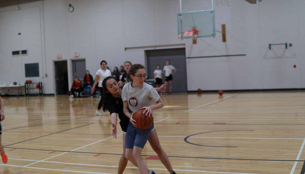 Students playing basketball