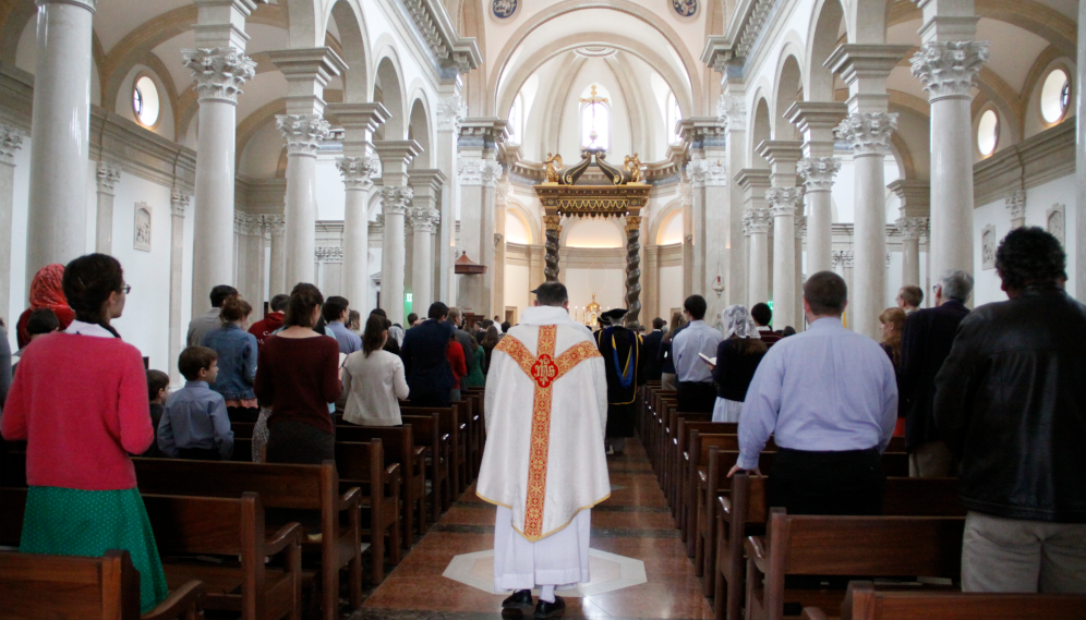 Following the faculty, Fr. Paul processes into the Chapel at the beginning of the St. Thomas Day Mass