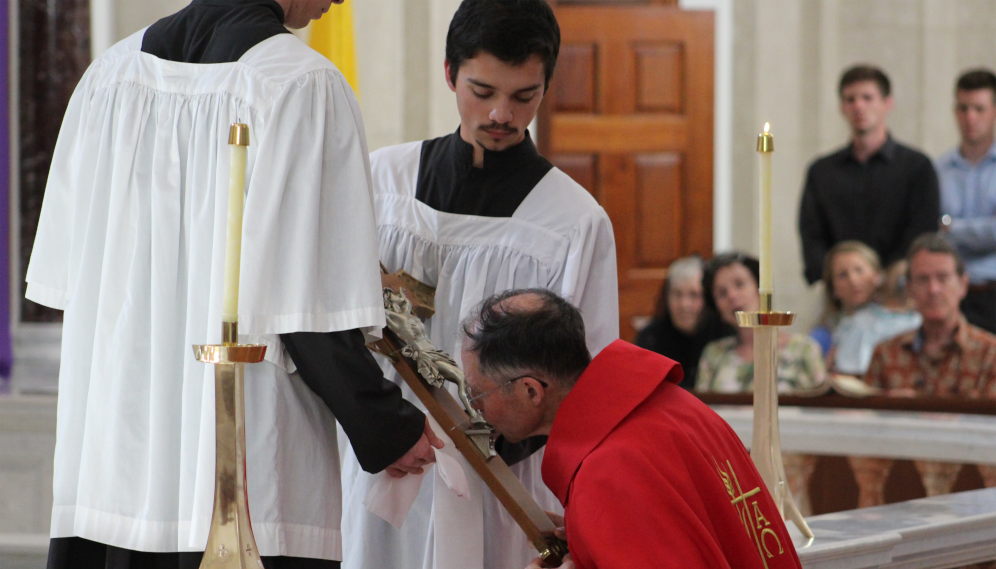 Fr. Paul venerates the Cross at a Good Friday service