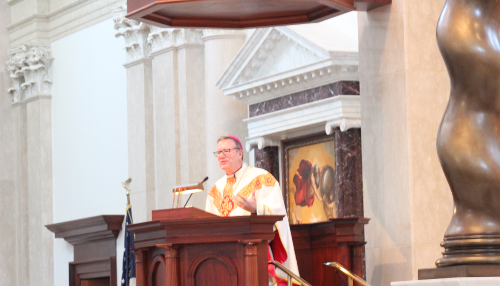4.	Bishop Barron preaches in Our Lady of the Most Trinity Chapel while visiting campus in 2016 …