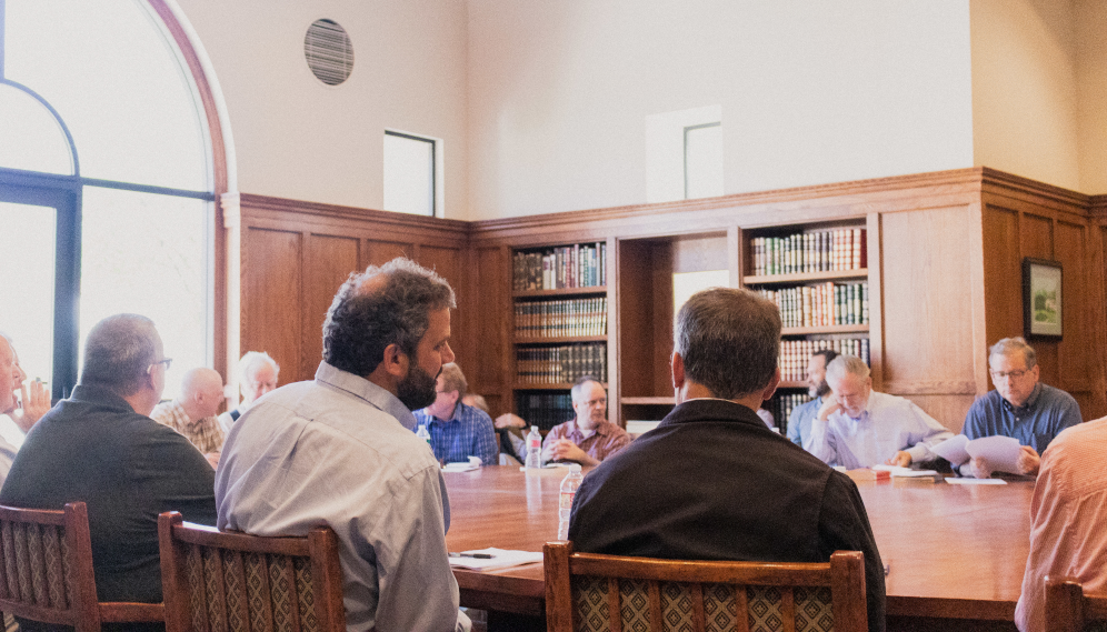 Tutors seated around the table