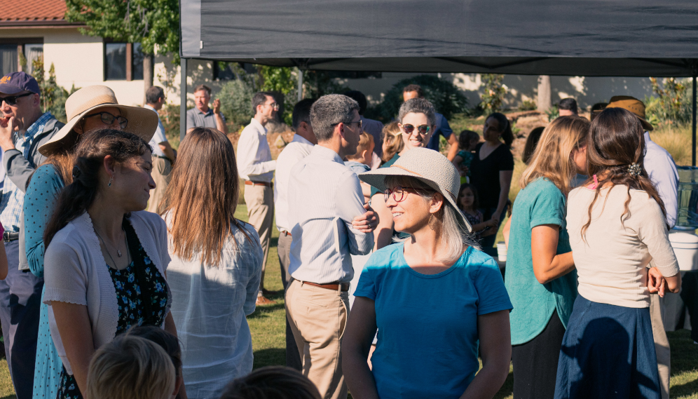 Tutor families chat outdoors