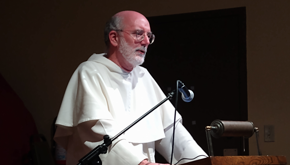 A Dominican priest delivers his address from the podium