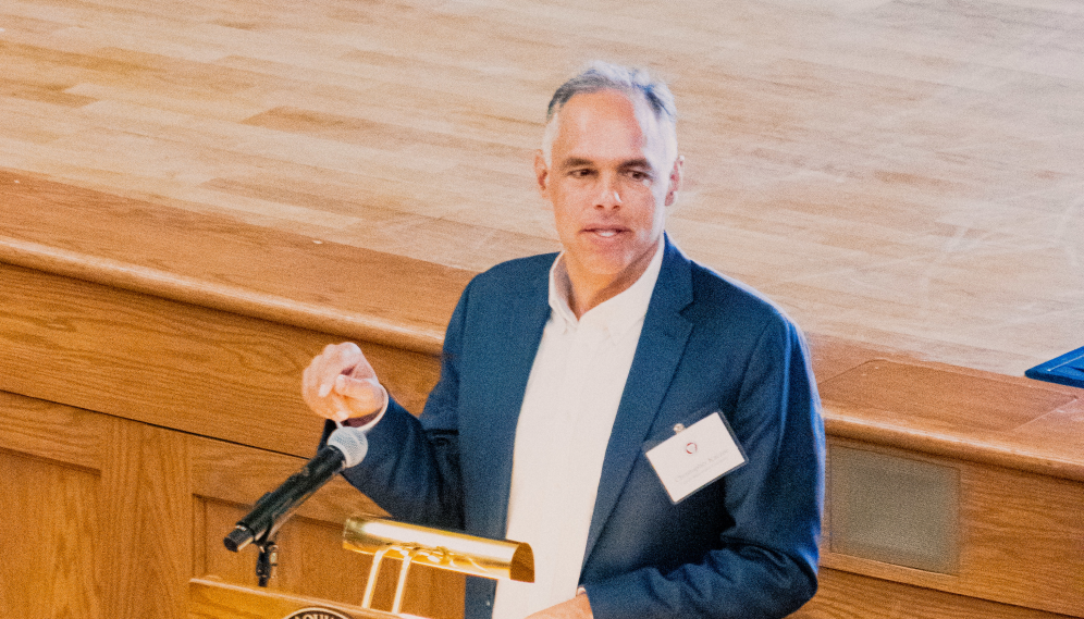 A lecturer speaks in the Auditorium