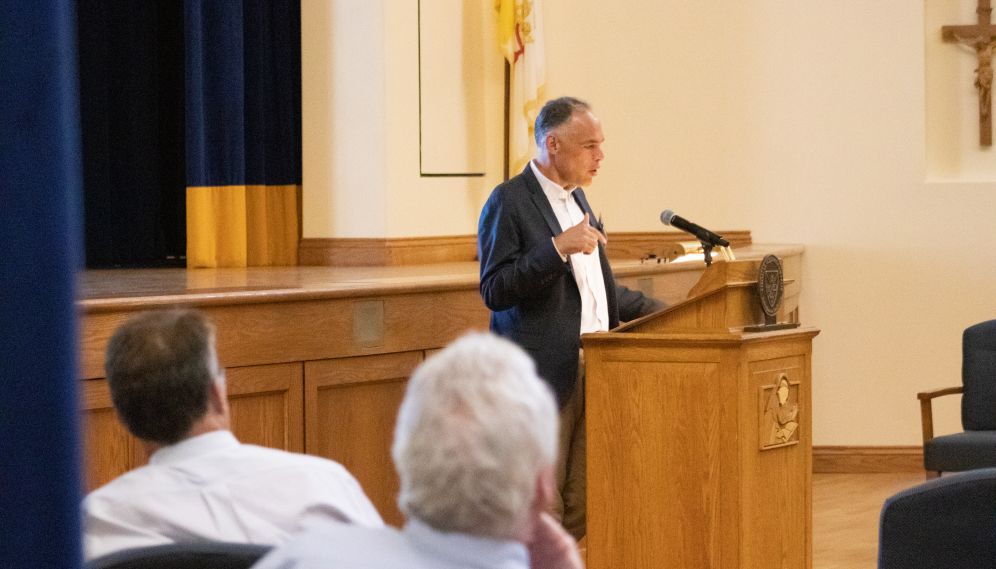 A lecturer presents in the Auditorium