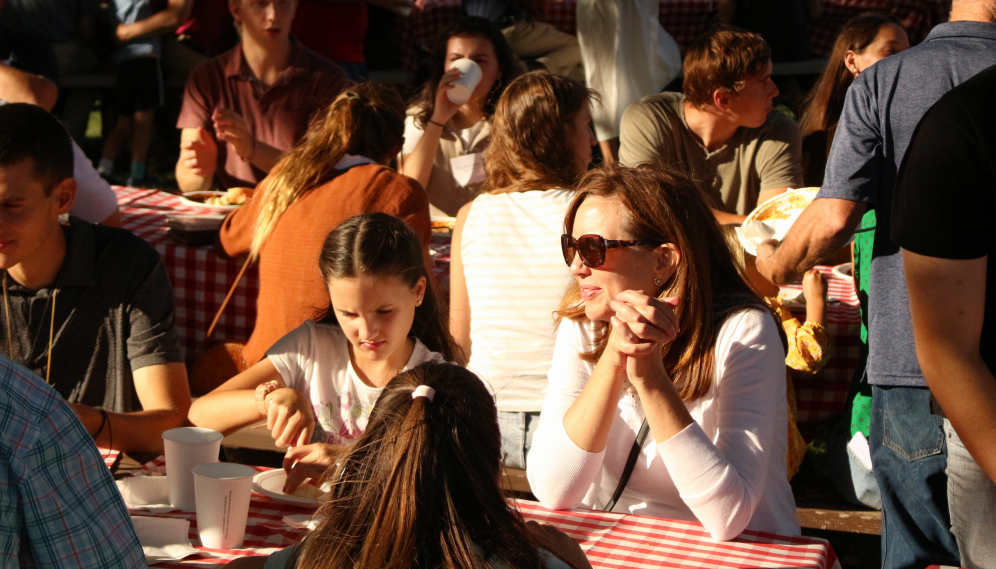 Students and their families at the tables
