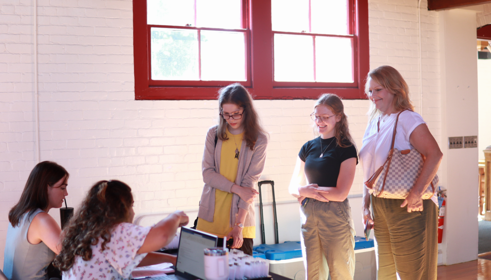 Students and family at the registration desk