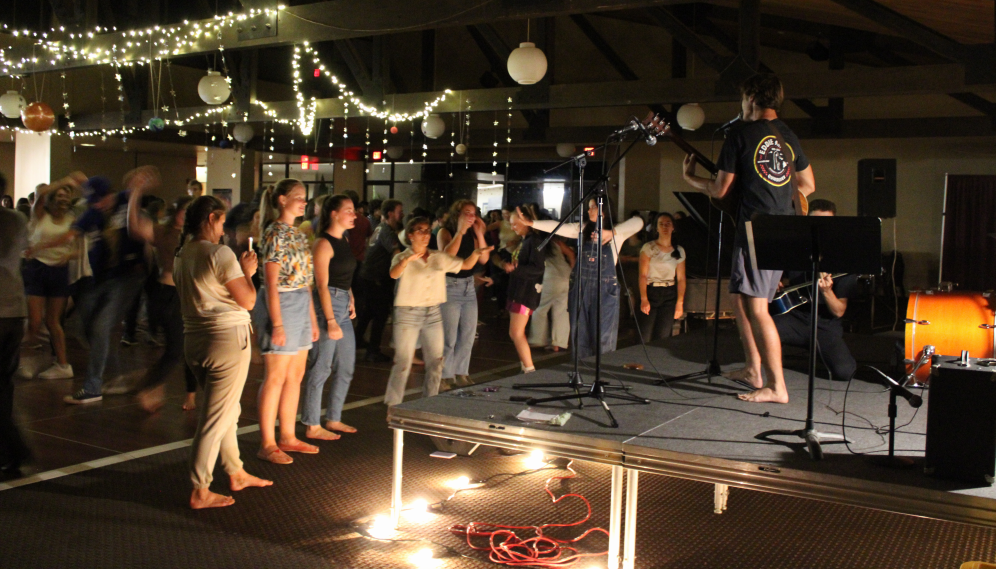 A row of students in the front line watch the musicians perform