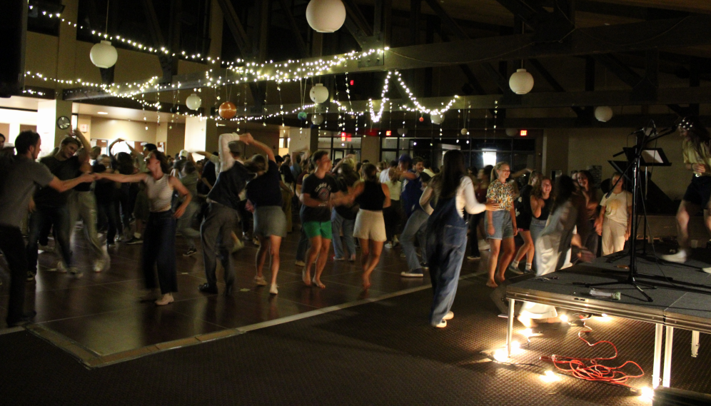 The students dance on the packed floor