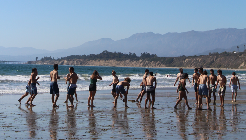 Games at the water's edge, with the mountains of Santa Barbara visible in the background