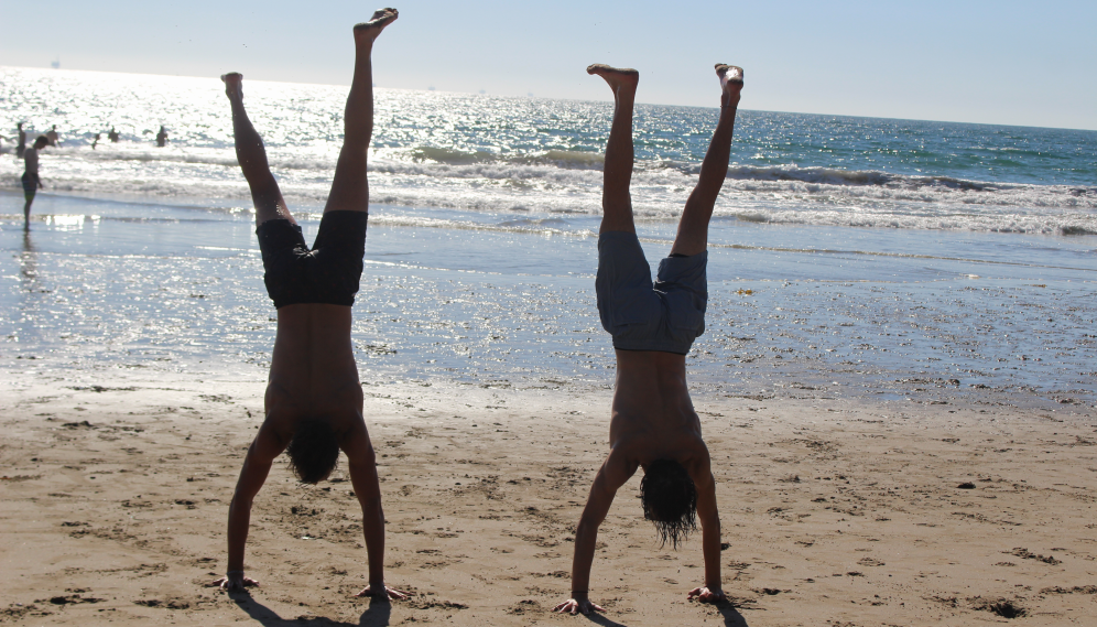 Two perform handstands