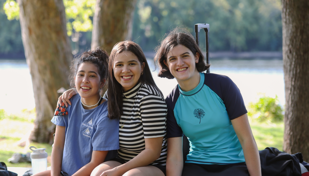 Three freshman pose for a photo