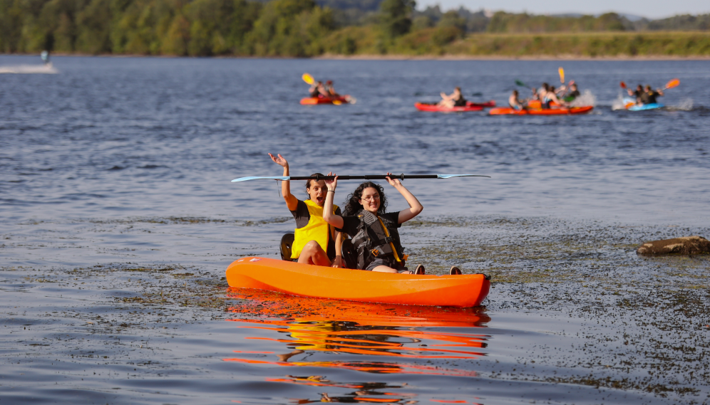 Two in their kayak out on the river