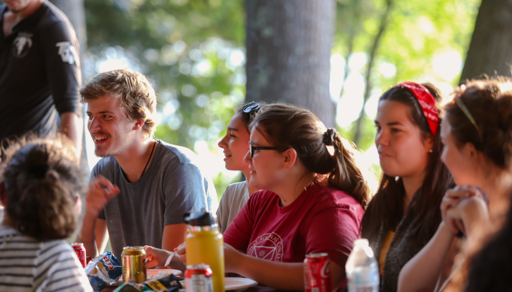 Students seated at the picnic table