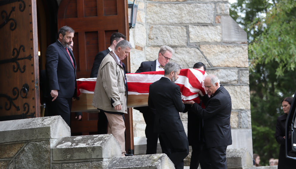 The pallbearers descend the Chapel steps with the casket