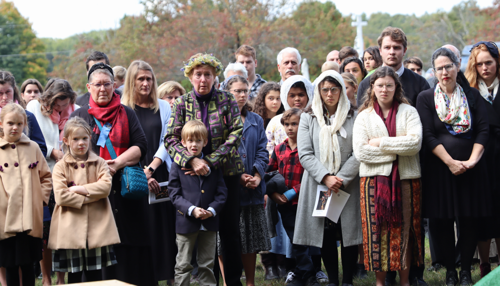 The assembled people watch