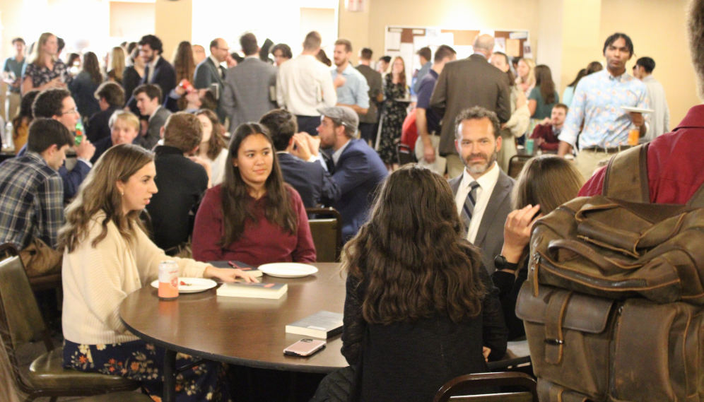 Students and tutors chat post-seminar in the Commons